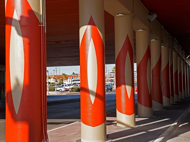 Painted Column Wraps rotate to form an arch in the center of the space